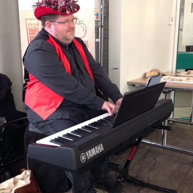 Christopher Lydon performing solo piano at Manchester Royal Eye Hospital